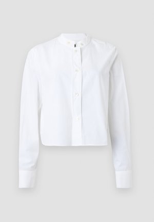 Camicia bianca corta con bottoni, collo alla coreana, maniche lunghe e piccoli bottoni, realizzata in tessuto di cotone liscio.