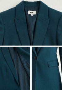 Teal kavaj med slagkrage, knäppning, sidoficka och slät innerfoder. Tillverkad av strukturtyg med skräddarsydd passform.