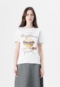 White cotton t-shirt featuring a colorful ice cream graphic with cherries and text. Short sleeves and a classic crew neckline.