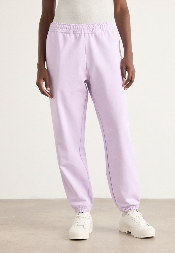 MONOLOGO - Tracksuit bottoms - lavender blush