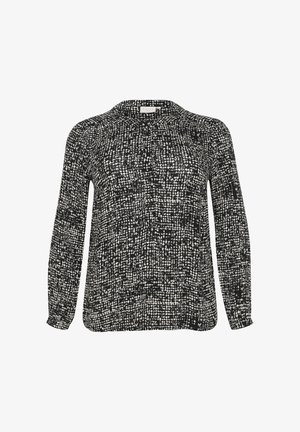 Blusa de manga larga en un patrón abstracto en blanco y negro. Tejido suave con escote redondo y puños fruncidos. Corte regular.