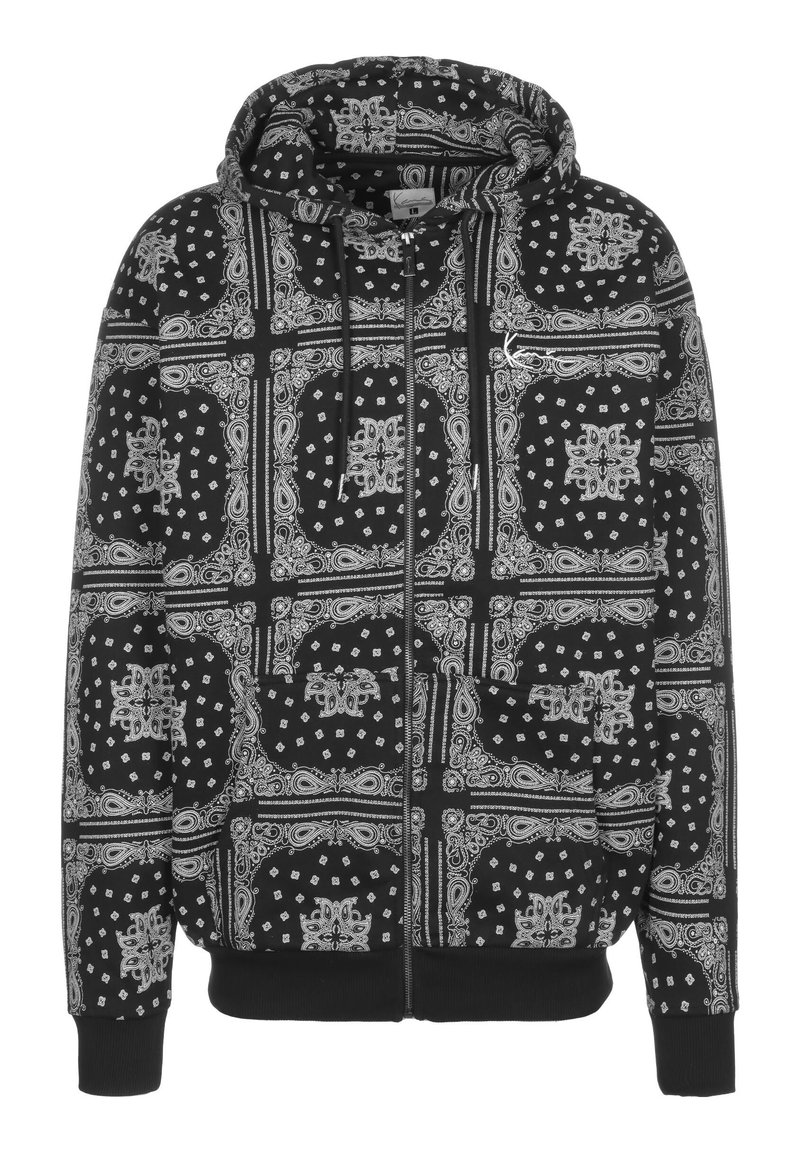 Felpa nera con cappuccio caratterizzata da una stampa bandana con motivi bianchi, maniche lunghe, zip frontale e due tasche anteriori. Tessuto testurizzato con cappuccio.