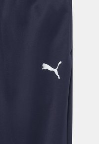 Puma TEAMRISE POLY TRAINING UNISEX - Treniņtērpa apakšdaļas - peacoat/puma white