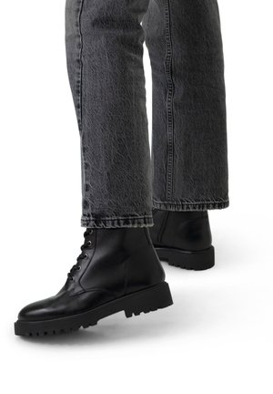 Manfield Bottines à plateau - schwarz