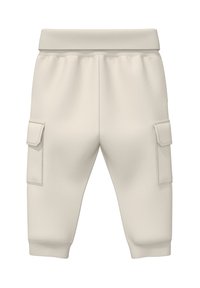 Krémové teplákové nohavice so slim fit strihom, elastickým pásom, manžetami na členkoch a dvoma bočnými cargo vreckami so zipsami.
