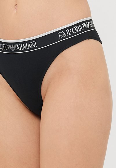 Zwarte katoenen bikini met een grijze tailleband met het "Emporio Armani" logo in het zwart. Gladde textuur, low-rise ontwerp, minimale bedekking.