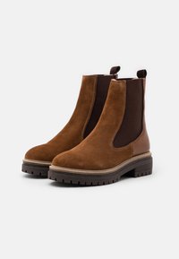 Copenhagen Shoes Botines con plataforma - cognac