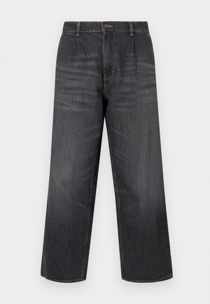 Jean large en denim foncé à taille haute, avec surpiqûres contrastantes, fermeture à bouton et deux poches avant. Texture lisse, coupe droite.