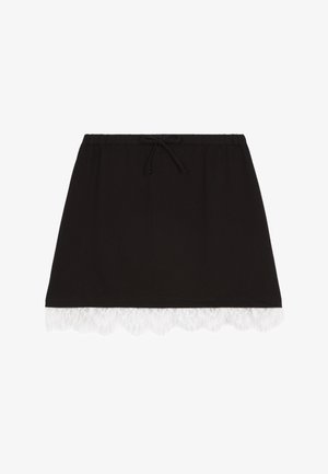 Jupe noire en jersey avec une taille élastique et un cordon de serrage, ornée d'une finition en dentelle blanche à l'ourlet. Design décontracté et léger.