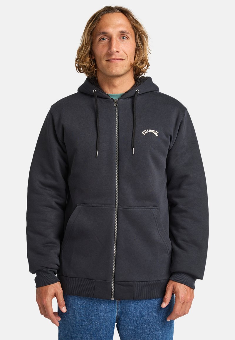 Dark gray zip-up hoodie made of soft fabric, featuring a drawstring hood, front pockets, and a white logo on the chest.