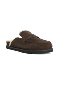 Brown suede slip-on slippers with a soft, cream-colored fur lining, round toe, and textured black rubber sole. Accented with cross-straps.