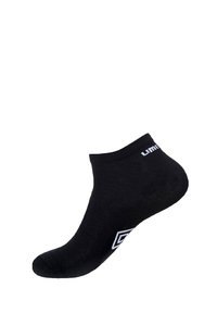 Chaussette noire à la cheville avec un bord côtelé et une marque blanche. Texture lisse avec une forme ajustée pour le confort. Aucun motif ni accent présent.