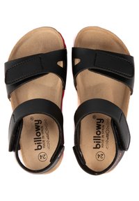 Sandales noires avec deux brides ajustables, dotées d'une semelle intérieure en douceur et d'une semelle extérieure en caoutchouc rouge. Marquées "billowy" et taille 24 à l'intérieur.