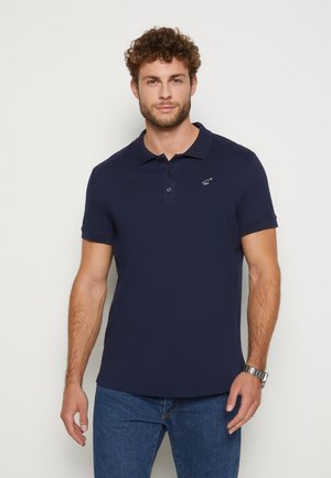 Marineblauwe polo met korte mouwen van katoen, voorzien van een klassieke kraag, drie knopen voor sluiting en een klein logo op de linker borst.