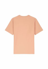 T-shirt à manches courtes, col rond, d'une douce couleur pêche, fabriqué en coton. Présente un dos uni avec des détails de couture minimalistes.