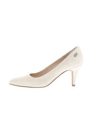 Beige suede women's pump with pointed toe, mid-height slim heel, and small decorative metal emblem near the heel collar.