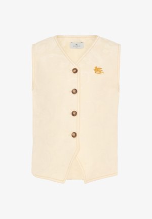 Chaleco sin mangas crema con escote en V, cuatro botones marrones, patrón sutil y pequeño emblema dorado de pájaro en el pecho izquierdo.