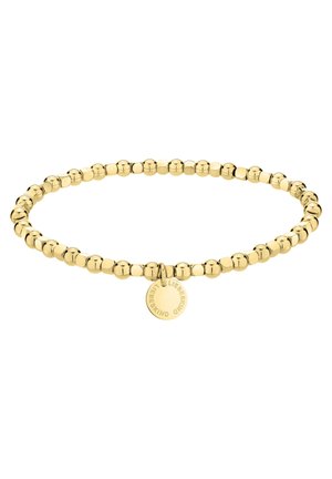 Bracelet élastique en perles dorées avec un petit charm rond gravé du mot "Liebeskind" sur fond blanc.
