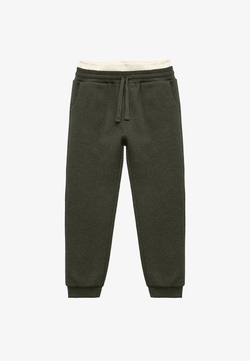 Dark green, textured knit sweatpants with an elastic waistband, cream-colored inner lining, and fitted cuffs. Features two side pockets.