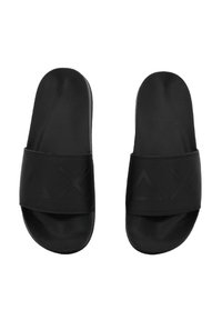 Black slide sandals with a smooth texture, featuring a wide strap displaying raised geometric symbols, cushiony footbed, and rounded edges.