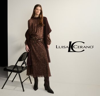 Flowy brown leopard print dress with ruffle neckline, paired with a dark brown shawl and belt, complemented by knee-high pointed boots.