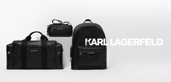 Three black Karl Lagerfeld bags in a row: a duffel bag, a small crossbody bag, and a backpack with embossed logo pattern.