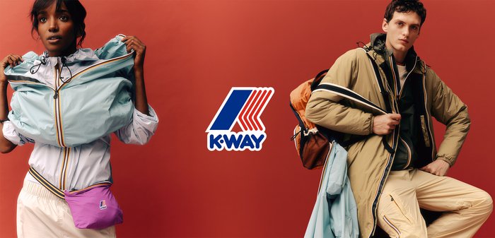Man and woman wearing and holding colorful K-Way jackets against a salmon background with K-Way logo above.