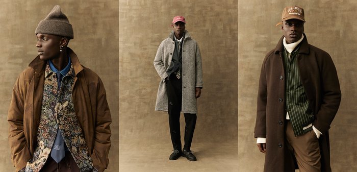 Tre stiliga outfits med en brun kappa, en grå houndstooth-kappa och en mörk randig jacka, lager över mönstrade skjortor och hattar.