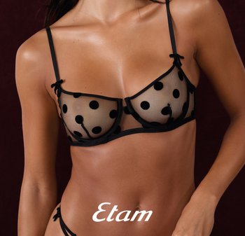 Schwarzer gepunkteter Mesh-BH mit transparenten Cups und zarten schwarzen Abschlüssen, verstellbaren Trägern und kleinen Schleifen an der Vorderseite.