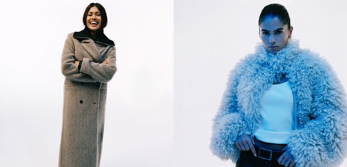 To kvinner i yttertøy: til venstre en lang grå ullkåpe med svart krage; til høyre en fluffy lys blå jakke med teksturert stoff. Begge modellerer moderne design.