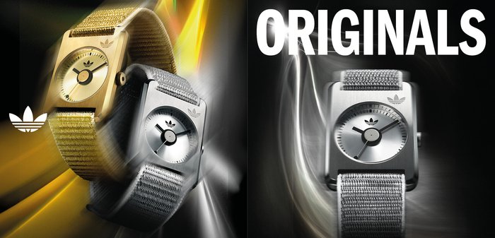 Gold- und silberfarbene quadratische Uhren mit Stoffarmbändern, die minimalistische Zifferblätter und Logoakzente zeigen. Text "ORIGINALS" deutlich sichtbar.