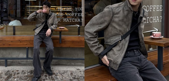 Jeune homme en veste grise et pantalon noir assis sur un rebord en pierre, tenant un sac noir, regardant sur le côté près d'un bâtiment avec une fenêtre à barreaux.