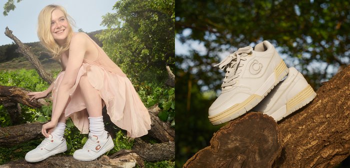 Bianche scarpe da ginnastica in pelle texturizzata, punta rotonda e dettagli crema. I lacci sono grigi chiari e presentano un logo circolare di lato.