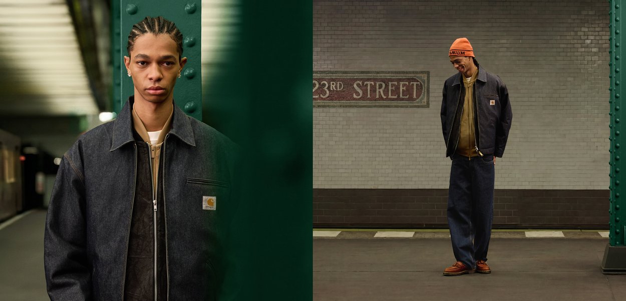 Joven con chaqueta y pantalones oscuros en una estación de metro, de pie cerca de un pilar verde y un cartel que dice "23rd Street" en una pared de azulejos.