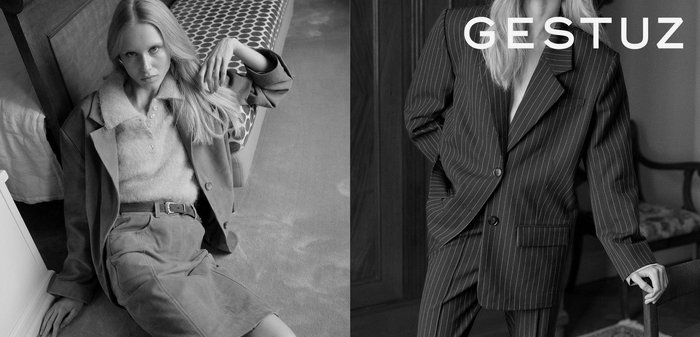 Model u sivom odijelu i svijetlom džemperu na lijevoj strani; s desne strane model u prugastom sako-u, oboje u crno-bijeloj tehnici. Jednostavna pozadina.