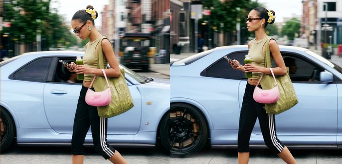 Jeune femme portant des lunettes de soleil marche dans une rue de la ville en tenant un téléphone et une boisson verte à côté d'une voiture de sport bleu clair.