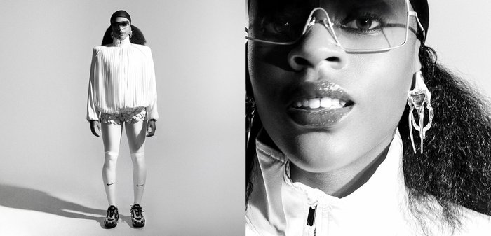 White pleated blouse and patterned shorts paired with white leggings and black sneakers. Accessories include oversized glasses and unique earrings.