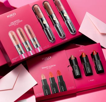 KIKO Milano lip sets displayed on a pink background. Features glossy tubes with shades ranging from nude to red, labeled with usage instructions.