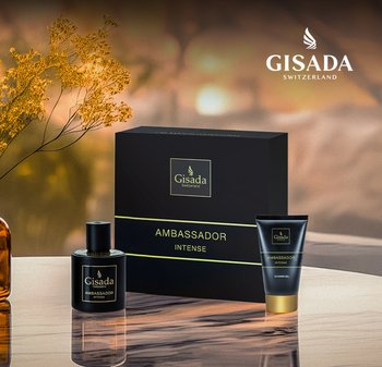 Schwarze Box mit der Aufschrift "Gisada Switzerland Ambassador Intense" neben einer schwarzen Parfümflasche und einer schwarzen Duschgel-Tube mit goldenen Akzenten.