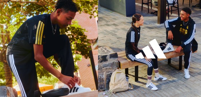 Jeunes portant des vêtements de sport Adidas noirs avec des rayures blanches, l'un lace ses chaussures, deux autres sont assis et discutent sur un banc à l'extérieur.