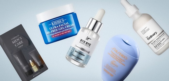 Produits de soins pour hommes comprenant une crème, un sérum, une crème solaire et un kit d'essai sur un fond clair.