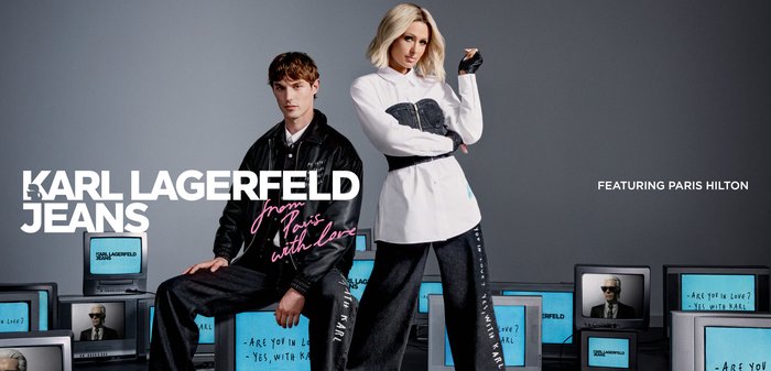 Two models pose in black and white outfits with multiple retro TVs around them displaying Karl Lagerfeld Jeans branding.