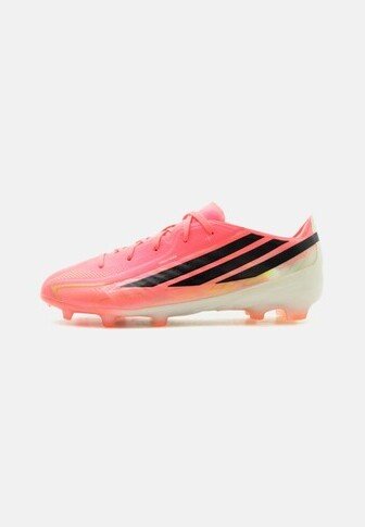 Pink soccer cleat with black diagonal stripes and a translucent sole, viewed from the side on a plain white background.