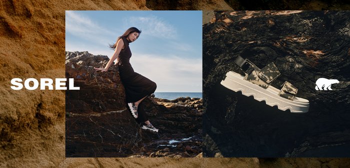 Woman wearing black dress and white sandals sitting on rocky terrain by the sea with a close-up of white platform sandal on dark rock.