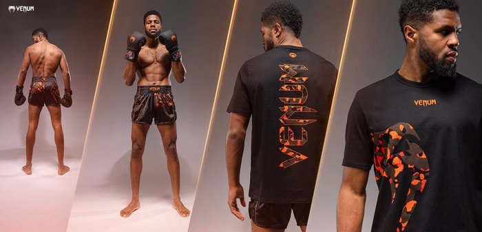 Schwarzes Sportoutfit mit orangefarbenen Akzenten. Das kurzärmelige Shirt hat einen auffälligen Grafikdruck auf der Vorderseite und das Logo "Venum" auf der Rückseite.