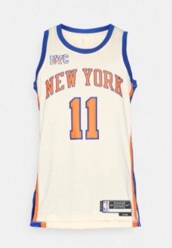 Balts basketbola krekls ar oranžiem un ziliem akcentiem. Priekšpusē ir uzdrukāts "NEW YORK" un numurs "11", kā arī uz pleca redzams "NYC".