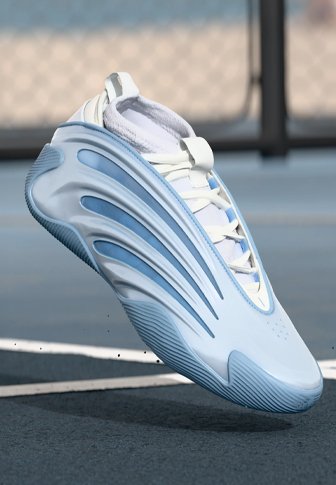 Valge spordijalgpall, millel on helesinised aktsendid, tekstureeritud kummist sääreosa ja eristatavad lainekujulised disainielemendid. Kerge ja modernne.