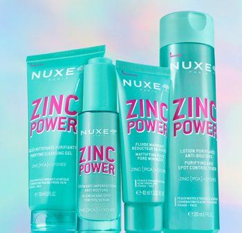 Quattro prodotti per la cura della pelle turchesi di NUXE, etichettati "Zinc Power", di forme e dimensioni diverse. Il testo mette in evidenza ingredienti chiave e benefici.