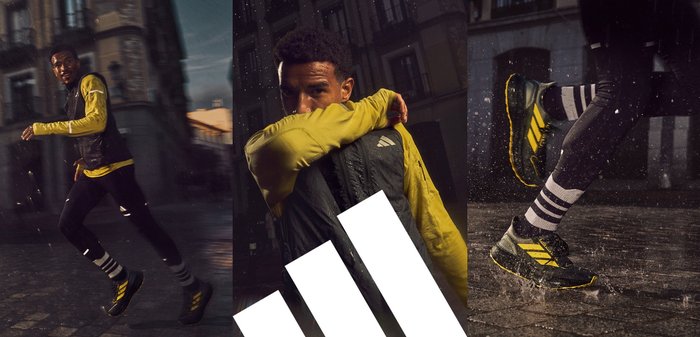 Mustat ja keltaiset urheilu kengät, joissa on teksturoitu pinta, esiteltynä juoksijan kanssa, joka on pukeutunut keltaiseen paitaan ja mustiin legginsseihin kosteassa kaupunkimaisemassa.