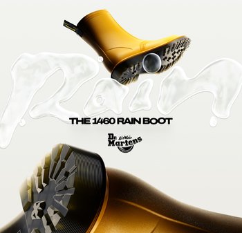 Stivale da pioggia in gomma gialla con punta tonda e suola nera texturizzata. Presenta il logo Dr. Martens in rilievo e gocce d'acqua.